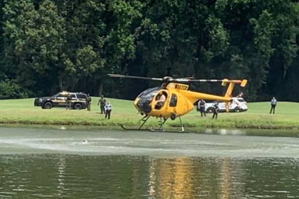 Georgia man fleeing police jumps into pond containing alligators