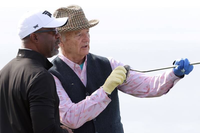 PEBBLE BEACH, CALIFORNIA - FEBRUARY 05: Actor Bill Murray (R) talks with singer Darius Rucker (L) on the fourth green during the third round of the AT&T Pebble Beach Pro-Am at Pebble Beach Golf Links on February 05, 2022 in Pebble Beach, California. (Photo by Jamie Squire/Getty Images)