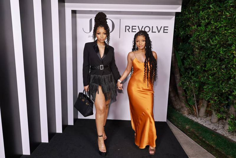 LOS ANGELES, CALIFORNIA - MARCH 18: (L-R) Chloe Bailey and Halle Bailey attend the launch of JLo Jennifer Lopez for Revolve Collection at a private residence on March 18, 2023 in Beverly Hills, California. (Photo by Matt Winkelmeyer/Getty Images for Revolve)