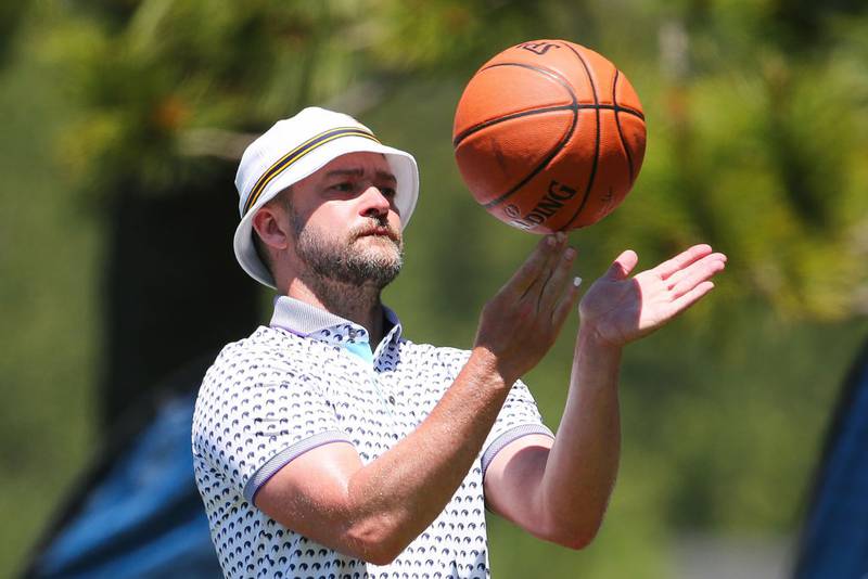 STATELINE, NV - JULY 10: Musician and actor Justin Timberlake plays with a basketball near hole 17 during the Final Round of the American Century Championship at Edgewood Tahoe Golf Course on July 10, 2022 in Stateline, Nevada. (Photo by Isaiah Vazquez/Clarkson Creative/Getty Images)